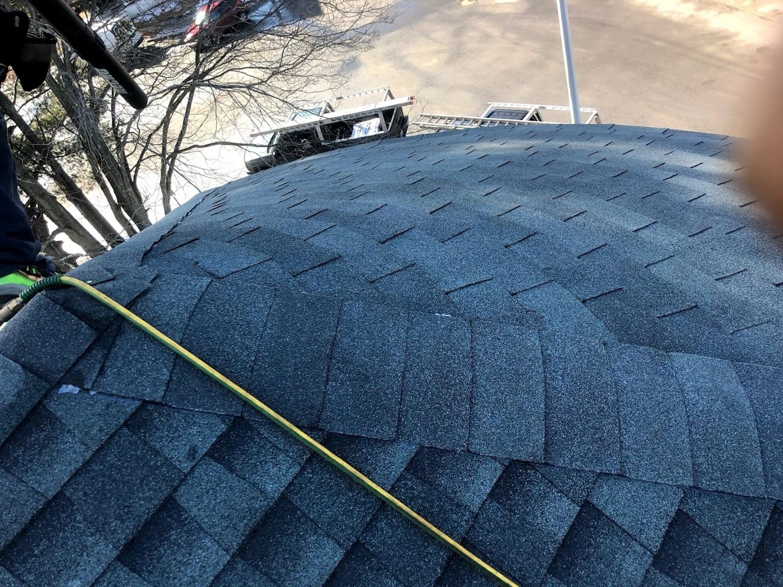 On-site safety cone — roofing project in progress