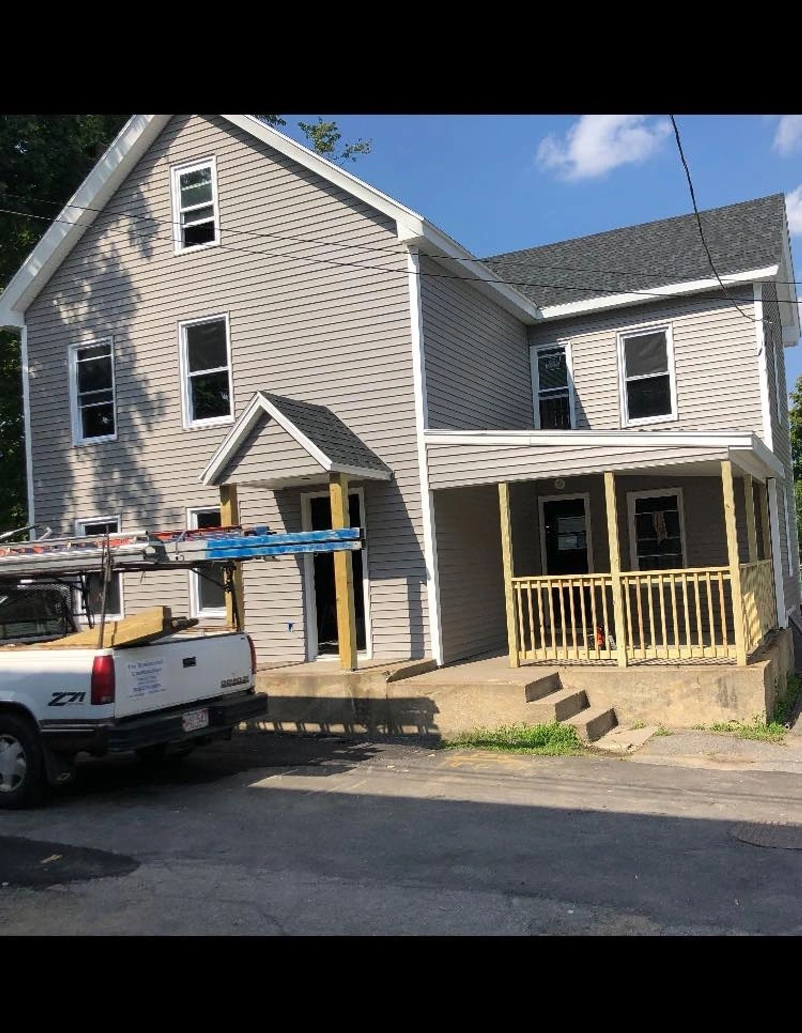 Completed shingle roof — finished view